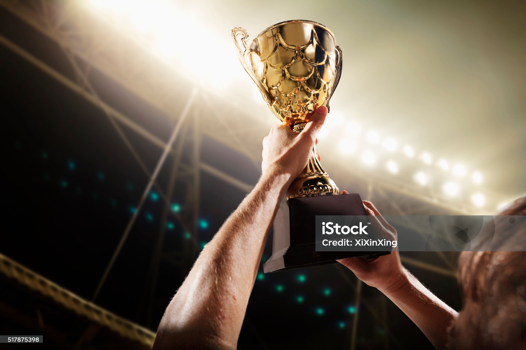 Athlete holding trophy cup